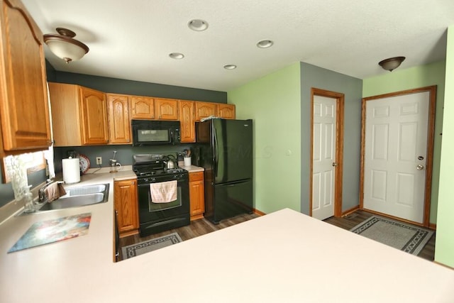 264 Ridgeway Dr, Howard, OH 43028 - kitchen with black appliances, dark wood-style flooring, light countertops, and recessed lighting
