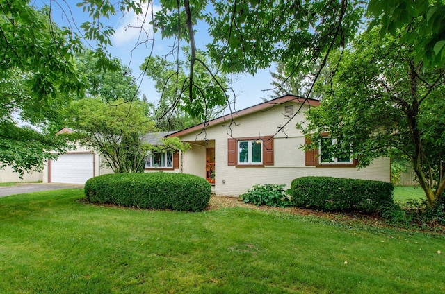 6103 Renner Rd, Columbus, OH 43228 - single story home with driveway, a front yard, and a garage