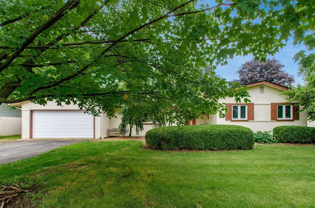 6103 Renner Rd, Columbus, OH 43228 - view of front of property featuring asphalt driveway, a front yard, and an attached garage