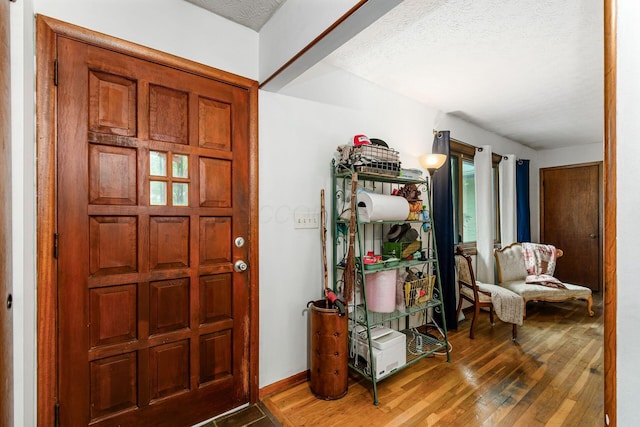 6103 Renner Rd, Columbus, OH 43228 - entryway featuring wood finished floors and a textured ceiling