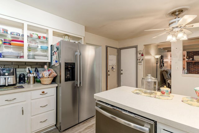 6103 Renner Rd, Columbus, OH 43228 - kitchen with appliances with stainless steel finishes, ceiling fan, light countertops, white cabinets, and light wood-style flooring