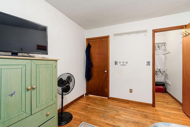 6103 Renner Rd, Columbus, OH 43228 - bedroom with light wood-type flooring and a textured ceiling