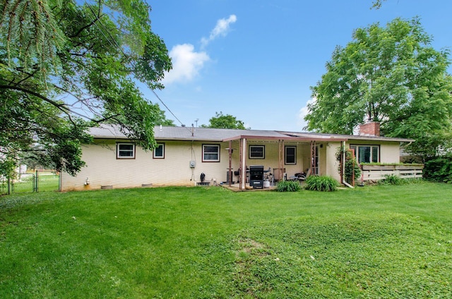 6103 Renner Rd, Columbus, OH 43228 - rear view of house featuring a chimney, a patio area, and brick siding