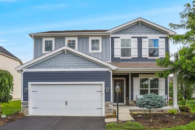 117 Sparrow Ct, Pickerington, OH 43147 - craftsman inspired home with asphalt driveway, stone siding, covered porch, and board and batten siding