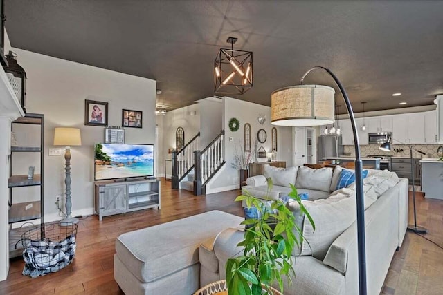 117 Sparrow Ct, Pickerington, OH 43147 - living room with a chandelier, stairs, wood finished floors, and recessed lighting