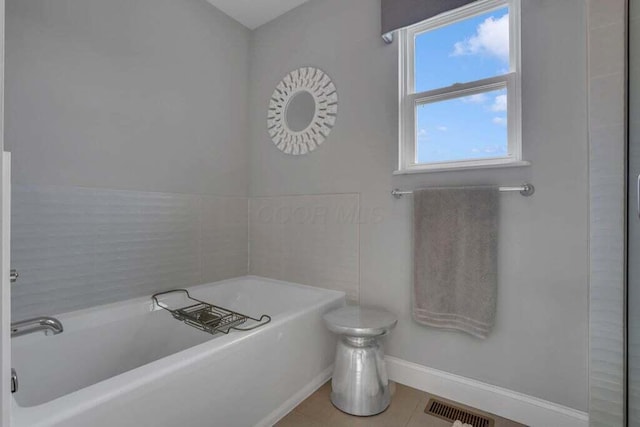 117 Sparrow Ct, Pickerington, OH 43147 - bathroom featuring a garden tub and tile patterned floors