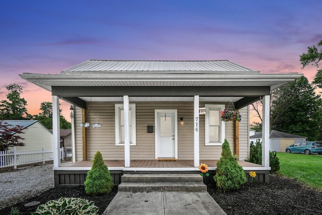 714 N Main St, Baltimore, OH 43105 - view of front of home featuring a porch and a metal roof