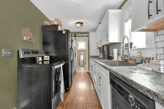 714 N Main St, Baltimore, OH 43105 - kitchen featuring stainless steel range with electric cooktop, dishwasher, white cabinetry, and light wood finished floors