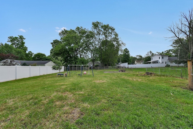 714 N Main St, Baltimore, OH 43105 - fenced backyard with a playground