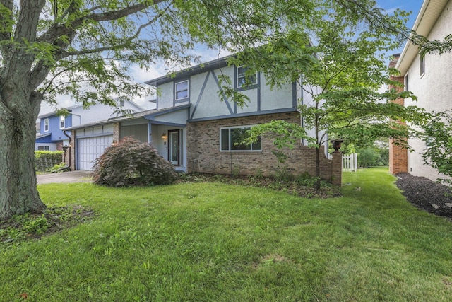 2809 Bella Via Ave, Columbus, OH 43231 - view of front of home with an attached garage, concrete driveway, a front lawn, brick siding, and stucco siding