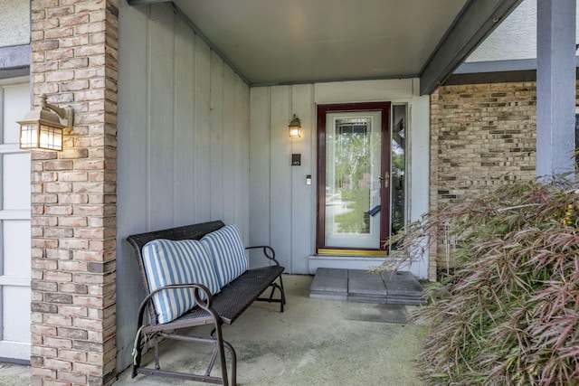 2809 Bella Via Ave, Columbus, OH 43231 - view of exterior entry with brick siding and a porch