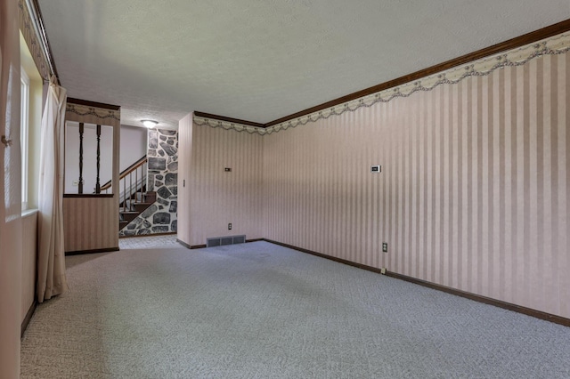 2809 Bella Via Ave, Columbus, OH 43231 - spare room featuring a textured ceiling, stairs, crown molding, and carpet floors