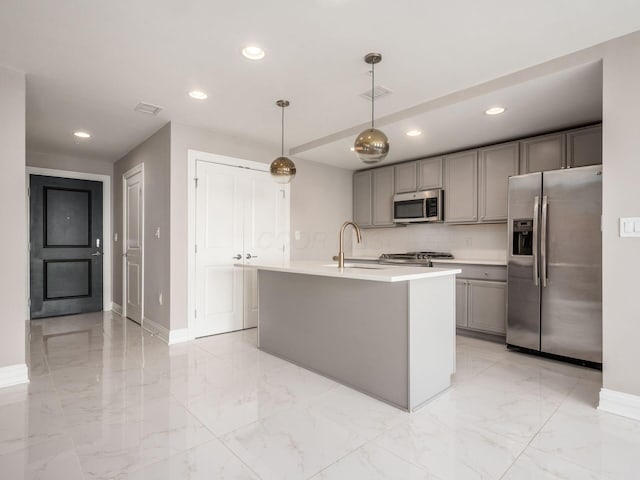 50 W Broad St Unit 2701, Columbus, OH 43215 - kitchen with stainless steel appliances, gray cabinets, recessed lighting, light marble finish floors, and light countertops