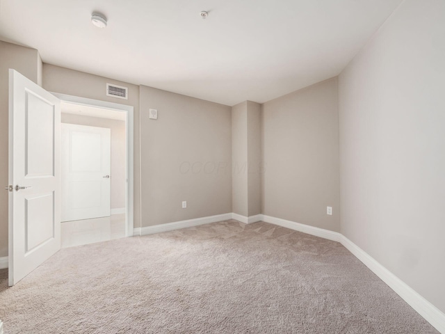50 W Broad St Unit 2701, Columbus, OH 43215 - carpeted spare room with a smoke detector and fire sprinkler in ceiling