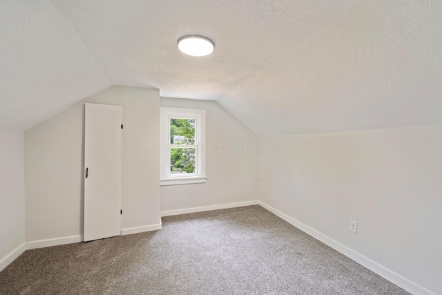 1430 Aberdeen Ave, Columbus, OH 43211 - bonus room with a textured ceiling, vaulted ceiling, and carpet flooring