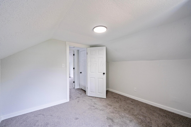 1430 Aberdeen Ave, Columbus, OH 43211 - additional living space with carpet, a textured ceiling, and lofted ceiling