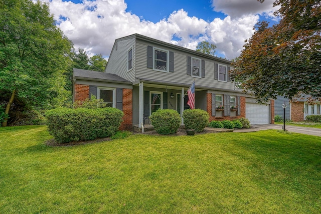 6676 Woodsedge Dr, Reynoldsburg, OH 43068 - view of front of property with brick siding, concrete driveway, a front lawn, and a garage