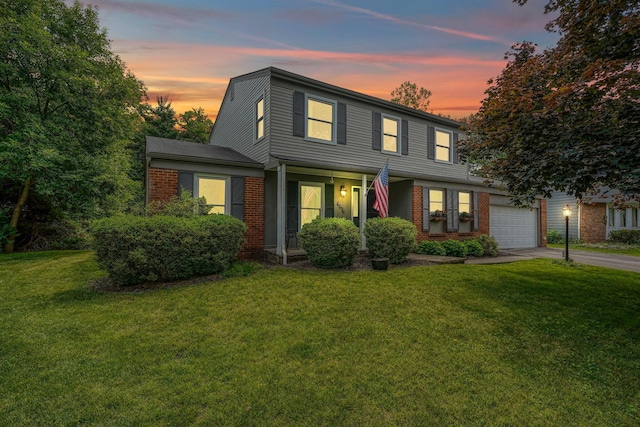 6676 Woodsedge Dr, Reynoldsburg, OH 43068 - traditional-style house with brick siding, concrete driveway, a front yard, and an attached garage