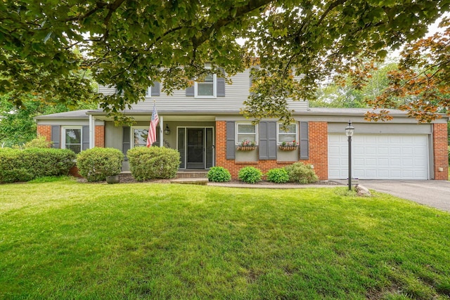 6676 Woodsedge Dr, Reynoldsburg, OH 43068 - view of front facade featuring brick siding, asphalt driveway, an attached garage, and a front lawn