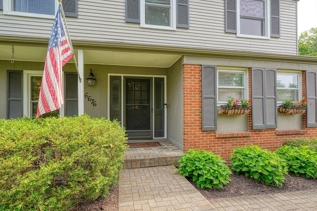 6676 Woodsedge Dr, Reynoldsburg, OH 43068 - view of exterior entry featuring brick siding