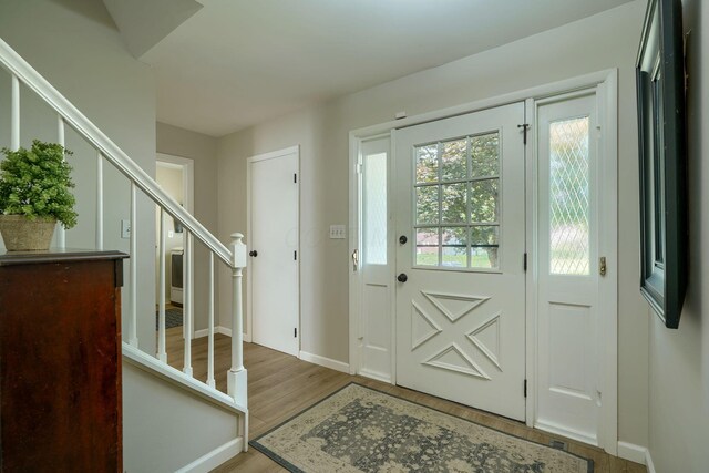 6676 Woodsedge Dr, Reynoldsburg, OH 43068 - foyer featuring stairs and wood finished floors