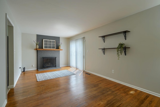 6676 Woodsedge Dr, Reynoldsburg, OH 43068 - unfurnished living room with a fireplace and wood finished floors
