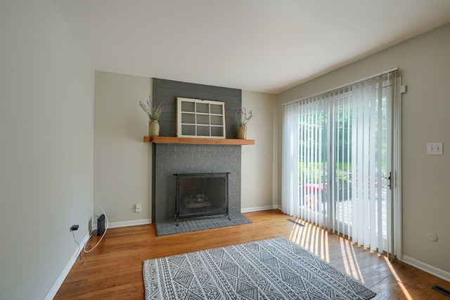 6676 Woodsedge Dr, Reynoldsburg, OH 43068 - unfurnished living room with wood finished floors and a fireplace