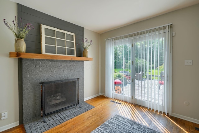 6676 Woodsedge Dr, Reynoldsburg, OH 43068 - unfurnished living room with wood finished floors and a fireplace
