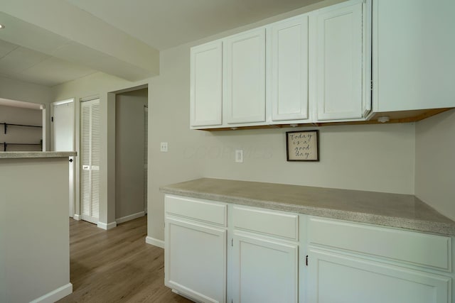 6676 Woodsedge Dr, Reynoldsburg, OH 43068 - kitchen featuring light wood finished floors, white cabinetry, and light countertops