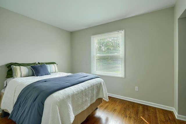 6676 Woodsedge Dr, Reynoldsburg, OH 43068 - bedroom featuring baseboards and wood finished floors