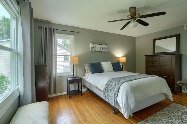 6676 Woodsedge Dr, Reynoldsburg, OH 43068 - bedroom with light wood-style floors and ceiling fan