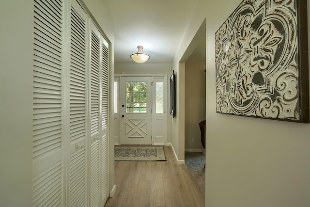 6676 Woodsedge Dr, Reynoldsburg, OH 43068 - doorway to outside featuring wood finished floors and baseboards