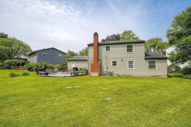 6676 Woodsedge Dr, Reynoldsburg, OH 43068 - rear view of house featuring a chimney, a lawn, and a patio
