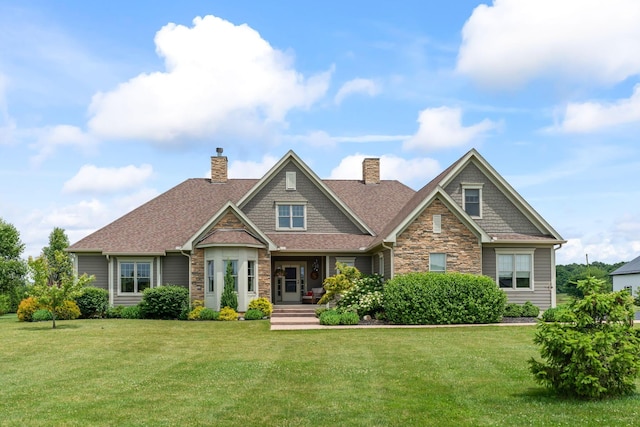 124 Dutch Ridge Way, Johnstown, OH 43031 - craftsman house featuring stone siding, a chimney, and a front yard