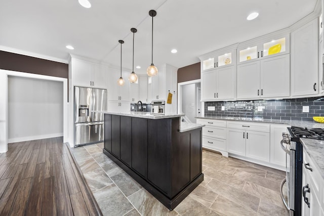 124 Dutch Ridge Way, Johnstown, OH 43031 - kitchen featuring stainless steel appliances, white cabinets, a kitchen island, recessed lighting, and ornamental molding