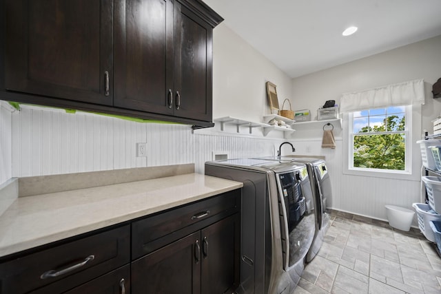 124 Dutch Ridge Way, Johnstown, OH 43031 - laundry area featuring cabinet space, separate washer and dryer, and light stone finish flooring