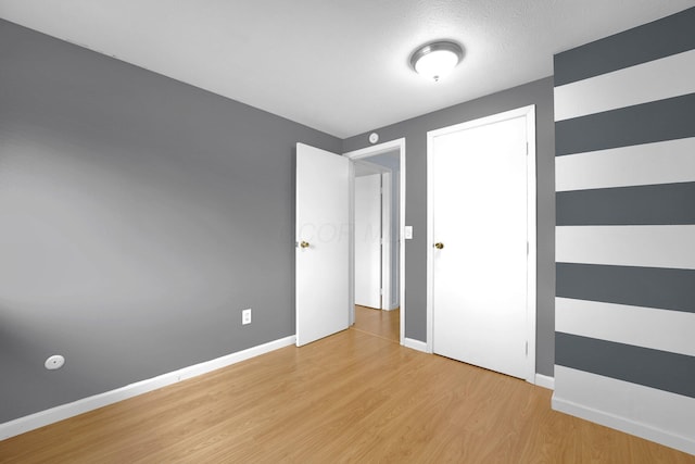 2047 Brookfield Rd, Columbus, OH 43229 - unfurnished bedroom featuring light wood-type flooring and baseboards