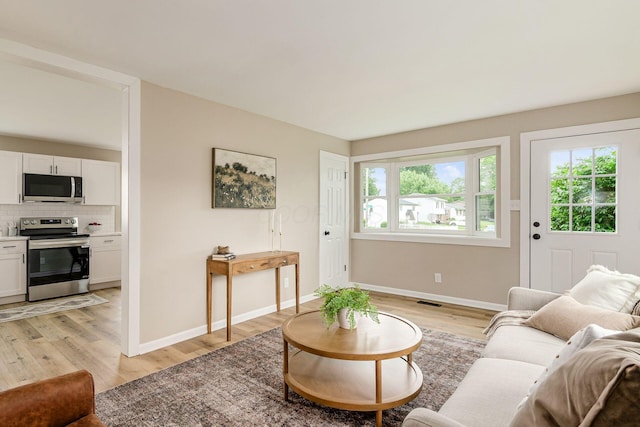 99 Ramona Ave, Newark, OH 43055 - living area with baseboards and light wood-style floors