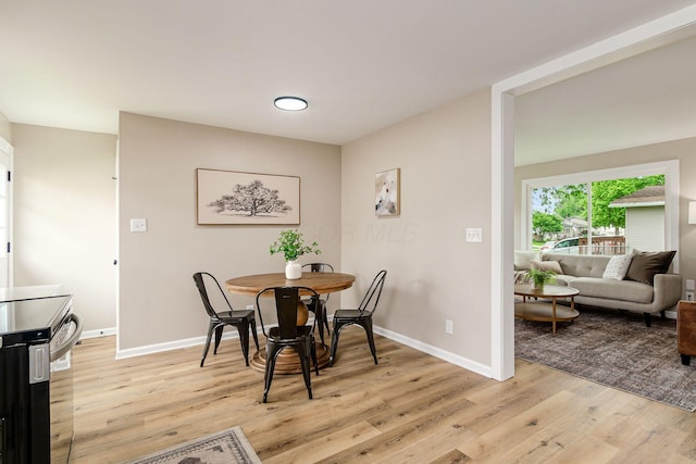 99 Ramona Ave, Newark, OH 43055 - dining room with light wood-type flooring and baseboards