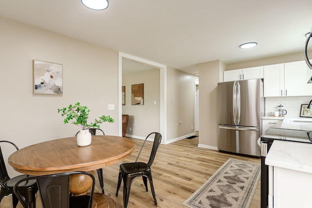 99 Ramona Ave, Newark, OH 43055 - dining room featuring light wood-style floors and baseboards