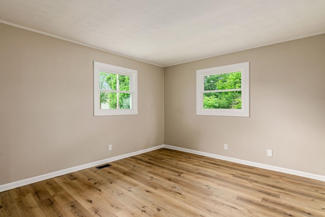 99 Ramona Ave, Newark, OH 43055 - spare room with plenty of natural light, wood finished floors, and ornamental molding
