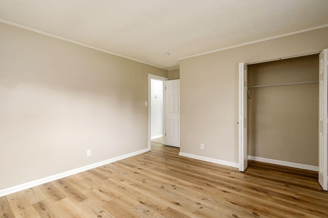 99 Ramona Ave, Newark, OH 43055 - unfurnished bedroom featuring light wood finished floors, ornamental molding, and a closet