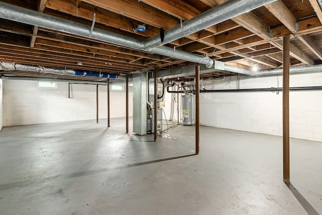 99 Ramona Ave, Newark, OH 43055 - basement with gas water heater, heating unit, and concrete block wall