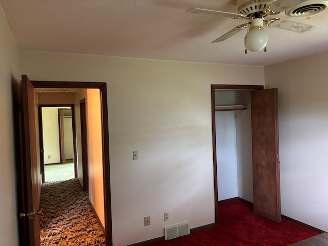54 Appleview Ct, Howard, OH 43028 - unfurnished bedroom with dark colored carpet, a closet, and ceiling fan