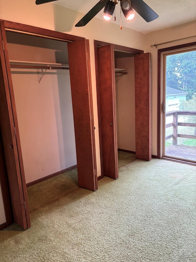 54 Appleview Ct, Howard, OH 43028 - unfurnished bedroom with carpet floors, multiple closets, and ceiling fan