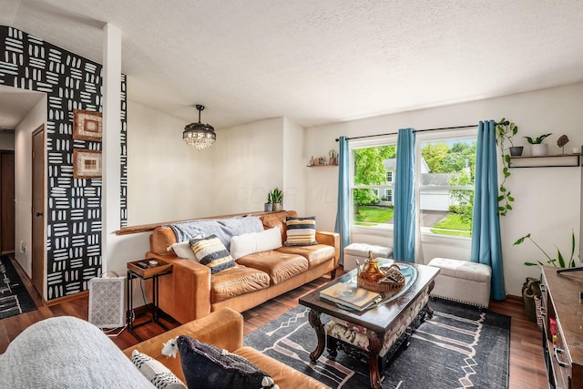 658 Academy Dr, Galloway, OH 43119 - living area with wood finished floors and a textured ceiling