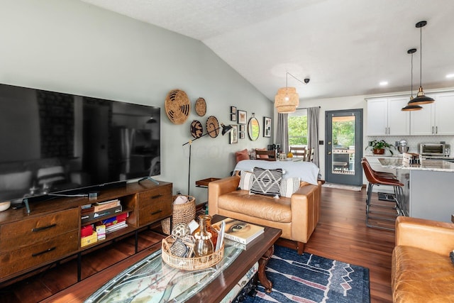 658 Academy Dr, Galloway, OH 43119 - living area featuring dark wood-style floors and lofted ceiling