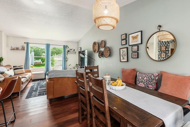 658 Academy Dr, Galloway, OH 43119 - dining space featuring dark wood-type flooring, lofted ceiling, and a textured ceiling