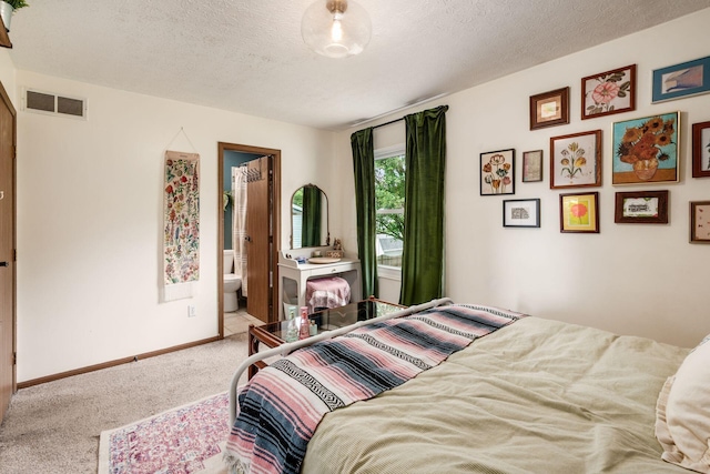 658 Academy Dr, Galloway, OH 43119 - bedroom featuring carpet, a textured ceiling, and ensuite bath