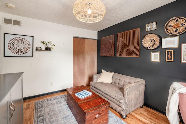 658 Academy Dr, Galloway, OH 43119 - living room with wood finished floors and a textured ceiling